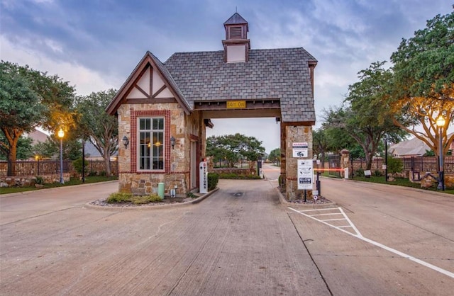 4145 Victory Dr, Frisco, TX 75034 - view of concrete road with a gated entry and curbs
