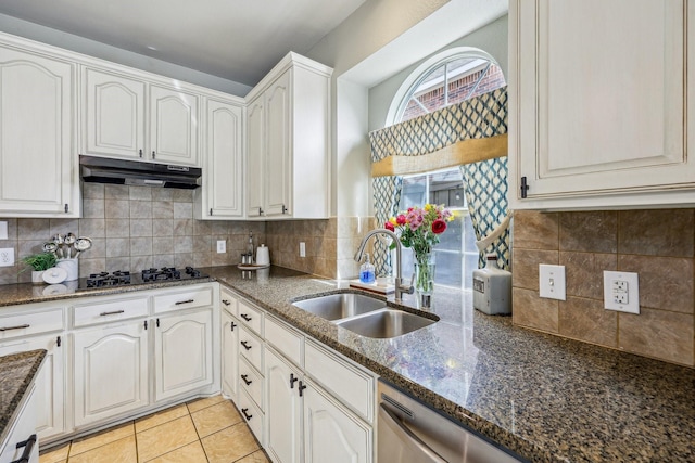 5603 Blazing Star Rd, Frisco, TX 75036 - kitchen featuring under cabinet range hood, black gas cooktop, a sink, and dark stone countertops