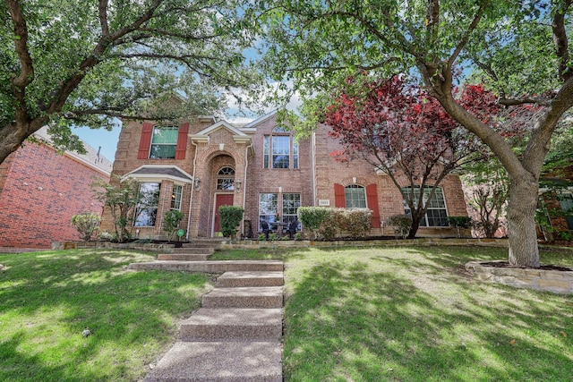 5603 Blazing Star Rd, Frisco, TX 75036 - traditional-style home featuring a front yard and brick siding