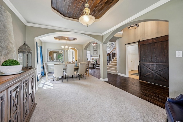 5603 Blazing Star Rd, Frisco, TX 75036 - carpeted entryway with a tray ceiling, arched walkways, baseboards, a chandelier, and wood ceiling
