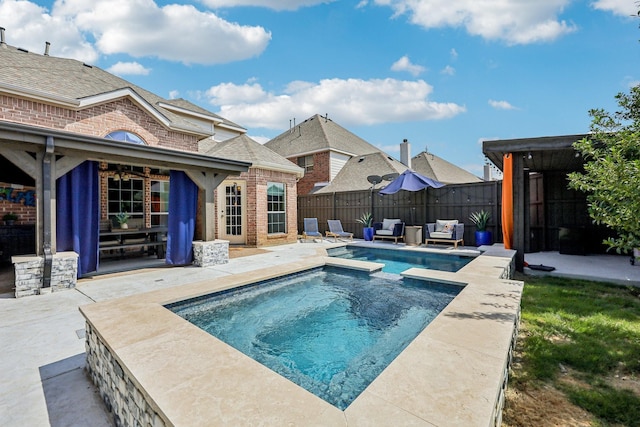 5603 Blazing Star Rd, Frisco, TX 75036 - view of pool with a patio, a fenced backyard, and a pool with connected hot tub