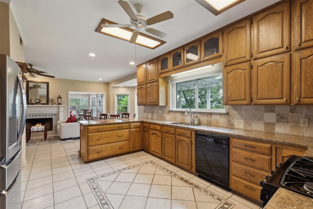 7632 Westwind Dr, Fort Worth, TX 76179 - kitchen featuring black appliances, a sink, a peninsula, a ceiling fan, and recessed lighting