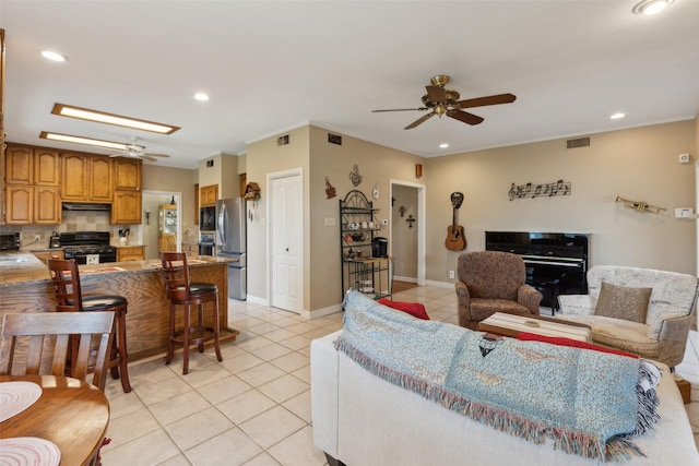 7632 Westwind Dr, Fort Worth, TX 76179 - living room featuring a ceiling fan, light tile patterned flooring, recessed lighting, and a skylight