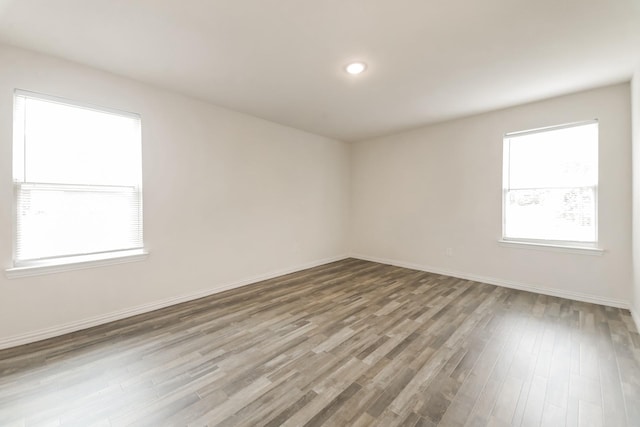 330 Flagship Ln, Gun Barrel City, TX 75156 - empty room with wood finished floors, baseboards, and recessed lighting