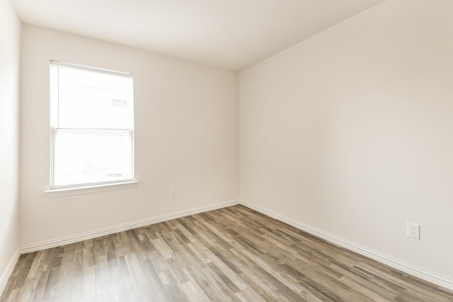 330 Flagship Ln, Gun Barrel City, TX 75156 - spare room featuring light wood-type flooring and baseboards