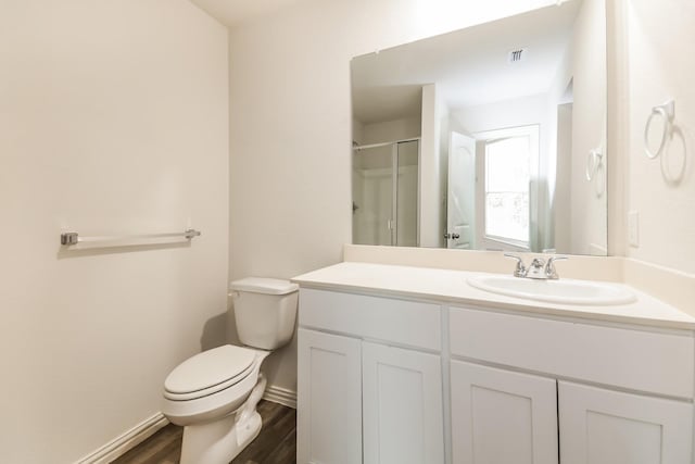 330 Flagship Ln, Gun Barrel City, TX 75156 - full bathroom with toilet, wood finished floors, vanity, an enclosed shower, and baseboards