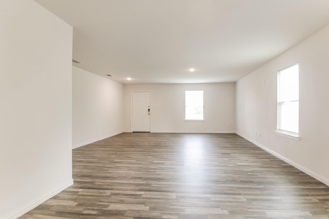 330 Flagship Ln, Gun Barrel City, TX 75156 - empty room with wood finished floors, recessed lighting, and baseboards