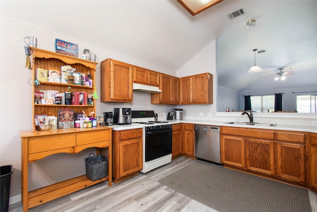1011 Liffey Dr, Pflugerville, TX 78660 - kitchen featuring dishwasher, range with gas cooktop, a sink, under cabinet range hood, and lofted ceiling