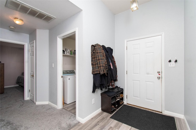 1011 Liffey Dr, Pflugerville, TX 78660 - foyer featuring washer / clothes dryer and baseboards