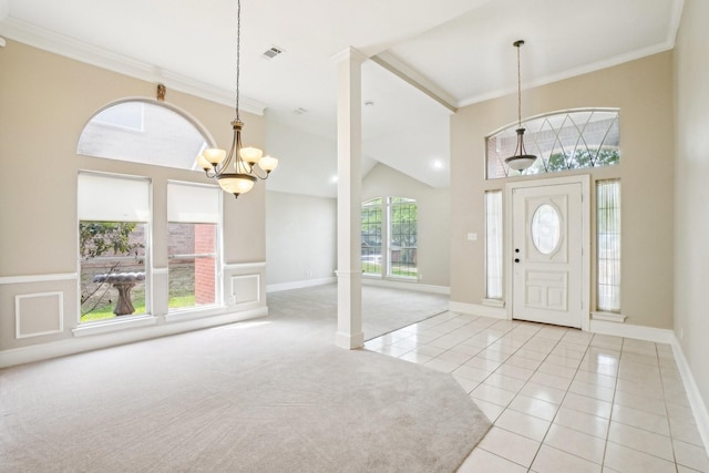 612 Christan Ct, Rockwall, TX 75087 - entryway with a chandelier, light colored carpet, light tile patterned floors, crown molding, and baseboards