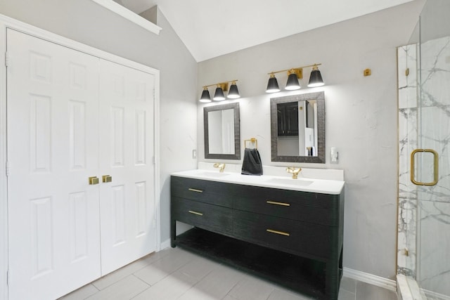 612 Christan Ct, Rockwall, TX 75087 - full bath featuring a marble finish shower, double vanity, lofted ceiling, and baseboards