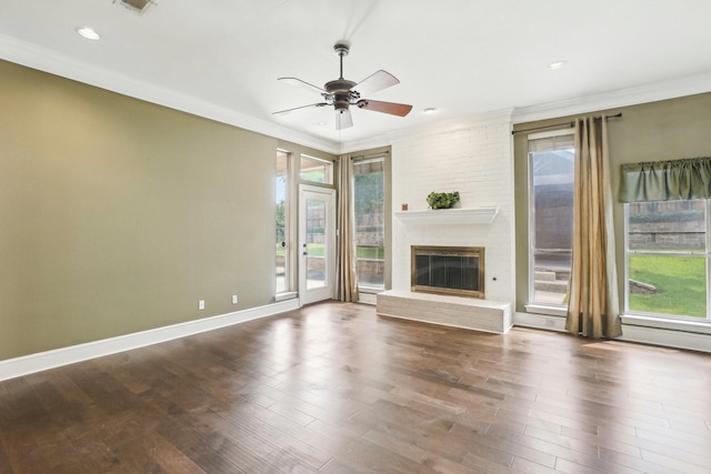 612 Christan Ct, Rockwall, TX 75087 - unfurnished living room featuring ornamental molding, wood finished floors, a ceiling fan, a fireplace, and recessed lighting