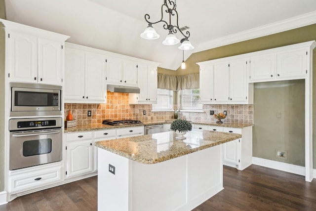 612 Christan Ct, Rockwall, TX 75087 - kitchen featuring appliances with stainless steel finishes, white cabinets, dark wood-type flooring, decorative backsplash, and ornamental molding