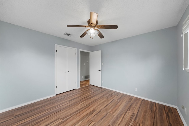 178 Norwood Dr, Woodway, TX 76712 - unfurnished bedroom featuring wood finished floors, baseboards, a closet, and ceiling fan