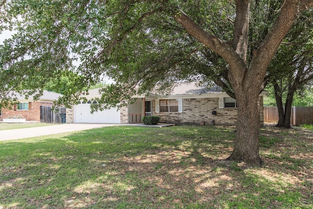 178 Norwood Dr, Woodway, TX 76712 - view of front of house featuring concrete driveway, brick siding, and a garage