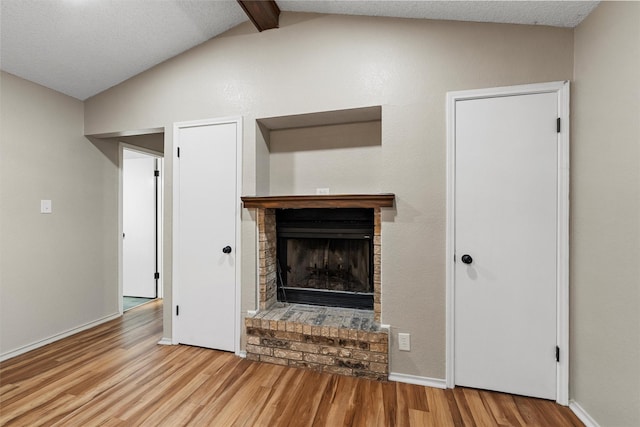 178 Norwood Dr, Woodway, TX 76712 - unfurnished living room with wood finished floors, a fireplace, and baseboards
