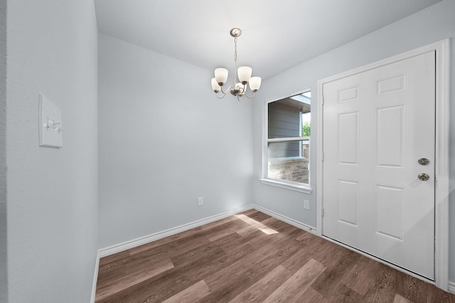 804 Hemlock Dr, West Tawakoni, TX 75474 - unfurnished dining area featuring dark wood finished floors, a chandelier, and baseboards