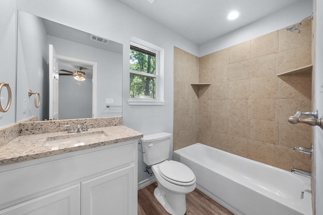 804 Hemlock Dr, West Tawakoni, TX 75474 - full bathroom with wood finished floors, toilet, vanity,  shower combination, and ceiling fan