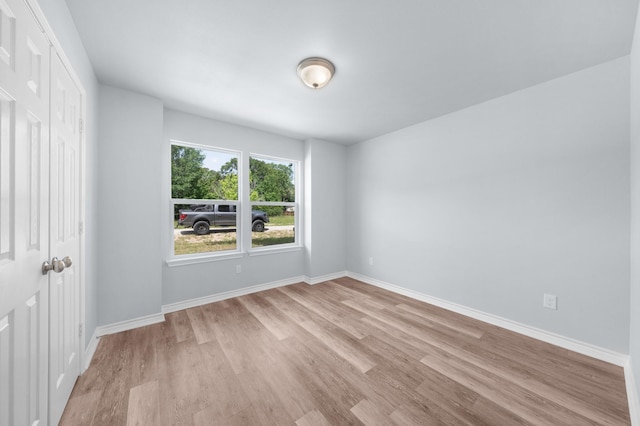 804 Hemlock Dr, West Tawakoni, TX 75474 - unfurnished bedroom with light wood finished floors, a closet, and baseboards