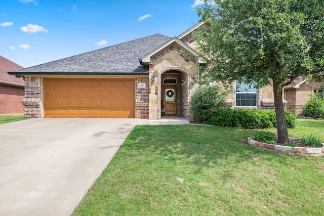 4307 Savannah Ln, Granbury, TX 76049 - french country style house with brick siding, a garage, a front yard, driveway, and a shingled roof