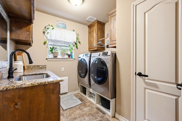 4307 Savannah Ln, Granbury, TX 76049 - laundry room with washing machine and clothes dryer, cabinet space, and baseboards