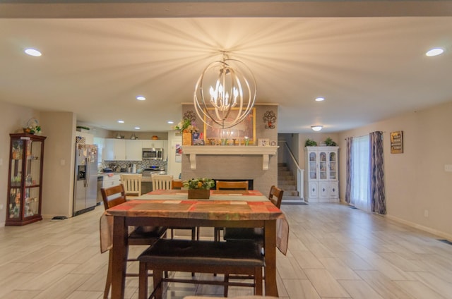 2209 Ridgewood Dr, Sherman, TX 75092 - dining room with baseboards, a chandelier, recessed lighting, a fireplace, and stairway