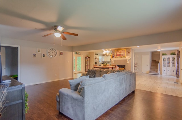2209 Ridgewood Dr, Sherman, TX 75092 - living room with wood finished floors, a ceiling fan, a fireplace, and baseboards