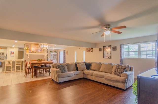 2209 Ridgewood Dr, Sherman, TX 75092 - living area featuring ceiling fan, wood finished floors, and a chandelier
