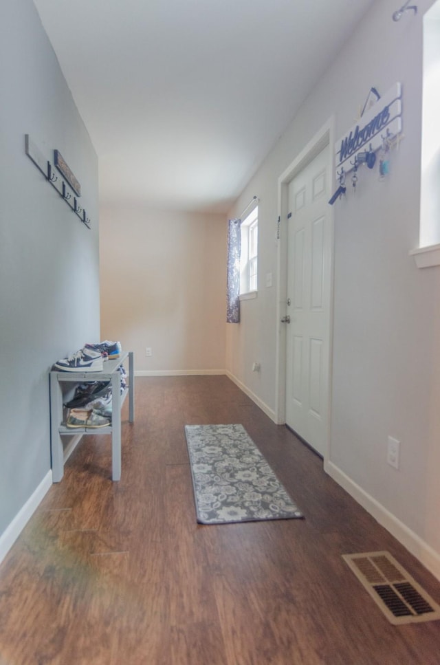 2209 Ridgewood Dr, Sherman, TX 75092 - entryway featuring baseboards and wood finished floors