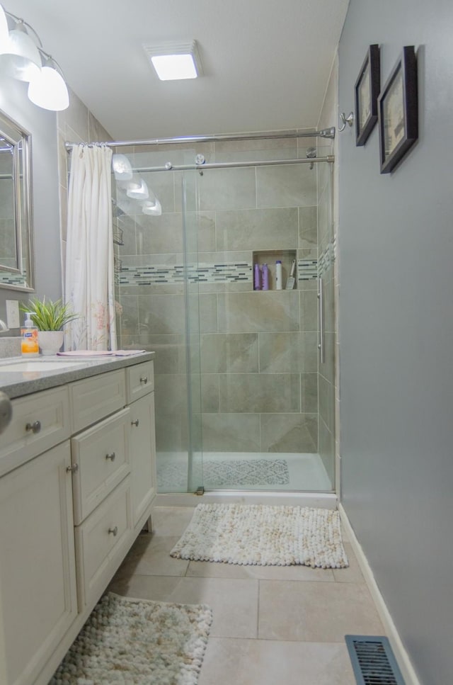 2209 Ridgewood Dr, Sherman, TX 75092 - full bathroom featuring a stall shower, tile patterned floors, and vanity