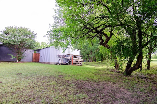 2209 Ridgewood Dr, Sherman, TX 75092 - view of green lawn featuring a pole building