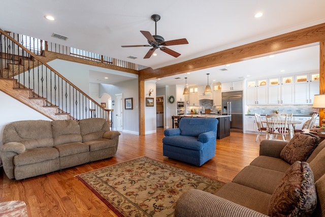 112 Mustang Dr, Fate, TX 75087 - living area featuring a ceiling fan, light wood finished floors, stairs, recessed lighting, and baseboards