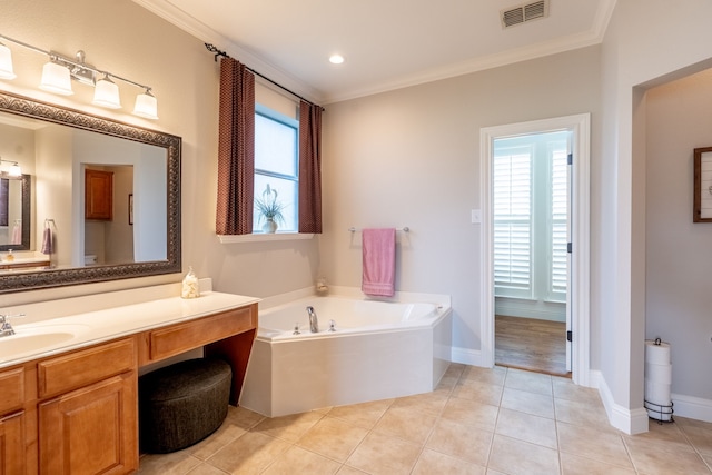 112 Mustang Dr, Fate, TX 75087 - bathroom featuring crown molding, a garden tub, tile patterned flooring, vanity, and baseboards