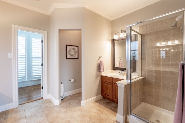112 Mustang Dr, Fate, TX 75087 - bathroom with a stall shower, tile patterned flooring, vanity, crown molding, and baseboards