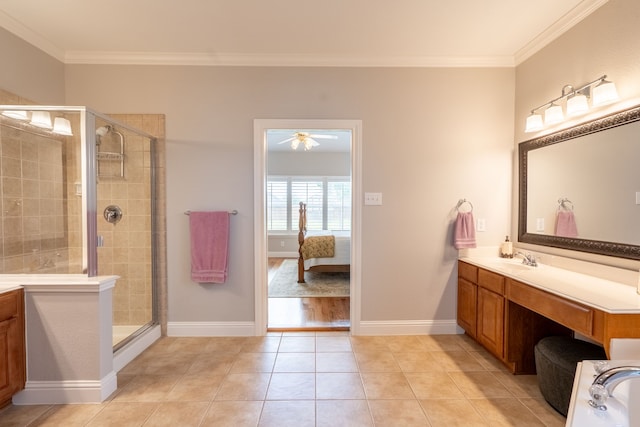 112 Mustang Dr, Fate, TX 75087 - ensuite bathroom with ornamental molding, vanity, a shower stall, a ceiling fan, and tile patterned flooring