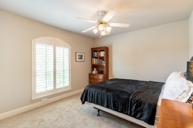 112 Mustang Dr, Fate, TX 75087 - carpeted bedroom featuring multiple windows, baseboards, and ceiling fan