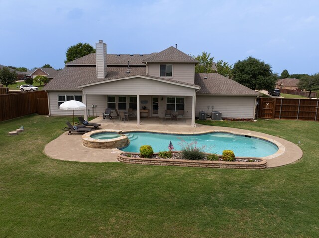 112 Mustang Dr, Fate, TX 75087 - view of swimming pool featuring a patio, a pool with connected hot tub, and central AC
