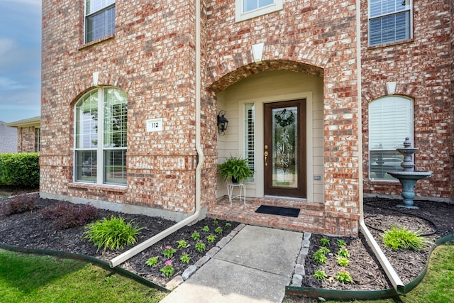 112 Mustang Dr, Fate, TX 75087 - doorway to property with brick siding