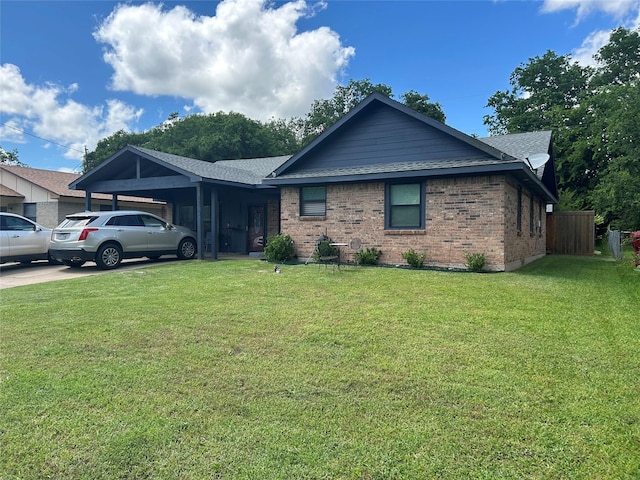 1313 E Turley St, Sherman, TX 75090 - ranch-style home with roof with shingles, an attached carport, a front lawn, and brick siding