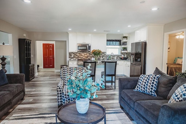 1313 E Turley St, Sherman, TX 75090 - living area featuring dark wood finished floors, recessed lighting, and baseboards