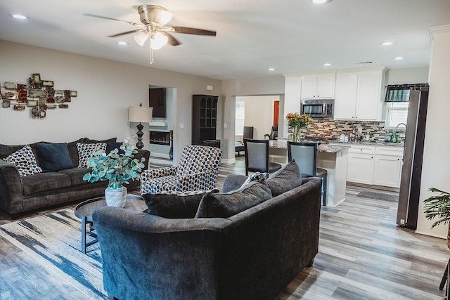 1313 E Turley St, Sherman, TX 75090 - living area featuring light wood-style flooring, ceiling fan, and recessed lighting