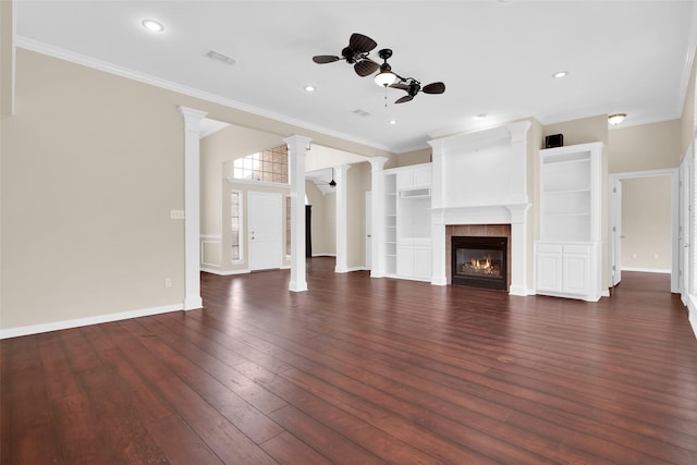 2103 Greenbrier St, Denison, TX 75020 - unfurnished living room featuring a ceiling fan, dark wood-style flooring, baseboards, ornamental molding, and a fireplace