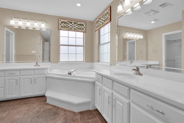 2103 Greenbrier St, Denison, TX 75020 - full bathroom with a garden tub and two vanities