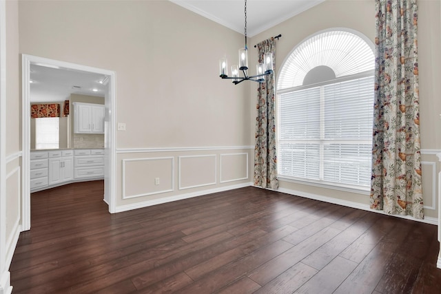 2103 Greenbrier St, Denison, TX 75020 - unfurnished dining area featuring a chandelier, dark wood-style flooring, and crown molding