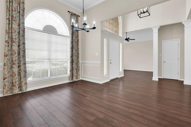 2103 Greenbrier St, Denison, TX 75020 - unfurnished dining area featuring a chandelier, dark wood-style flooring, baseboards, ornamental molding, and a high ceiling