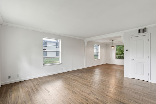 5033 N Hall St, Dallas, TX 75235 - empty room featuring crown molding, wood finished floors, and baseboards
