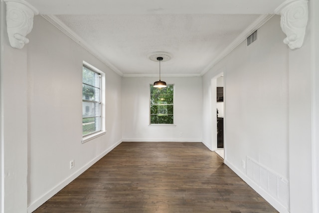 5033 N Hall St, Dallas, TX 75235 - unfurnished dining area featuring healthy amount of natural light, crown molding, dark wood-style flooring, and baseboards