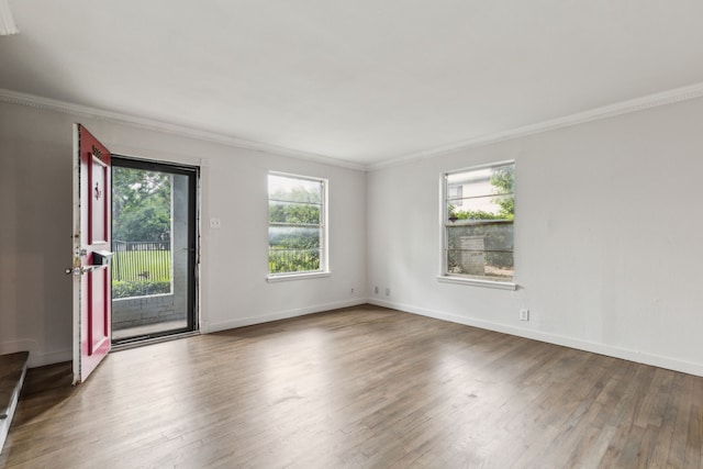 5033 N Hall St, Dallas, TX 75235 - empty room featuring plenty of natural light, crown molding, wood finished floors, and baseboards