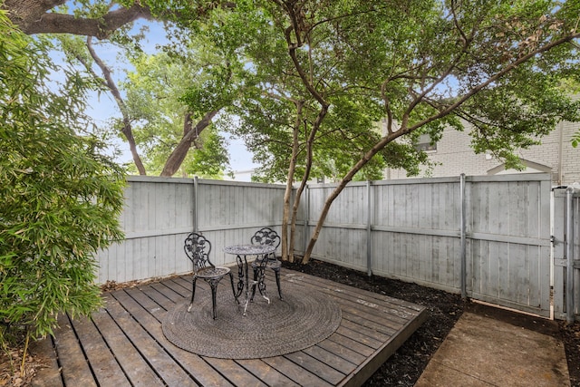 5033 N Hall St, Dallas, TX 75235 - wooden terrace featuring a fenced backyard