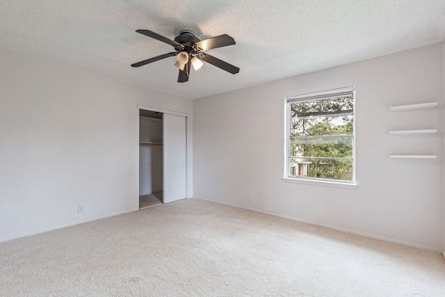 5033 N Hall St, Dallas, TX 75235 - unfurnished bedroom with light carpet, a closet, a textured ceiling, and a ceiling fan